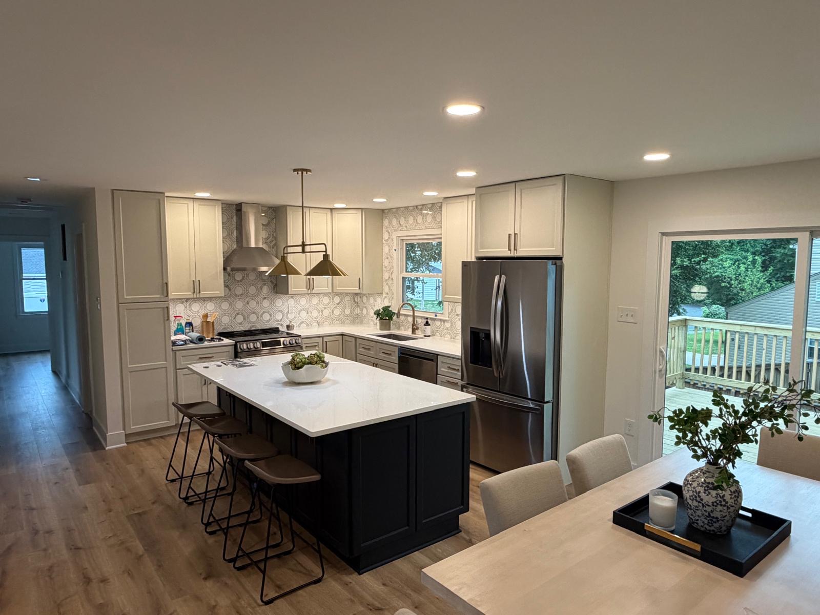 Remodeled kitchen with geometric backsplash